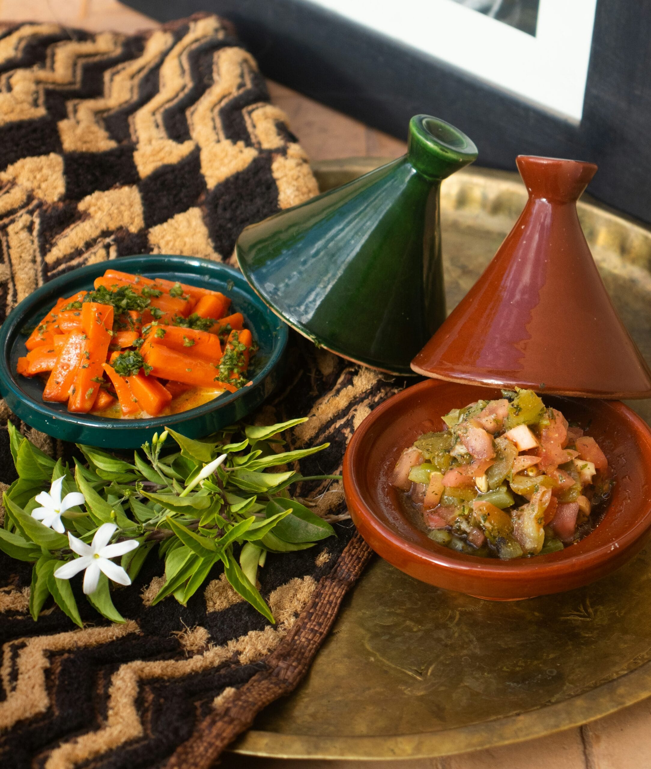 A Moroccan-style meal with side salads and vegetables