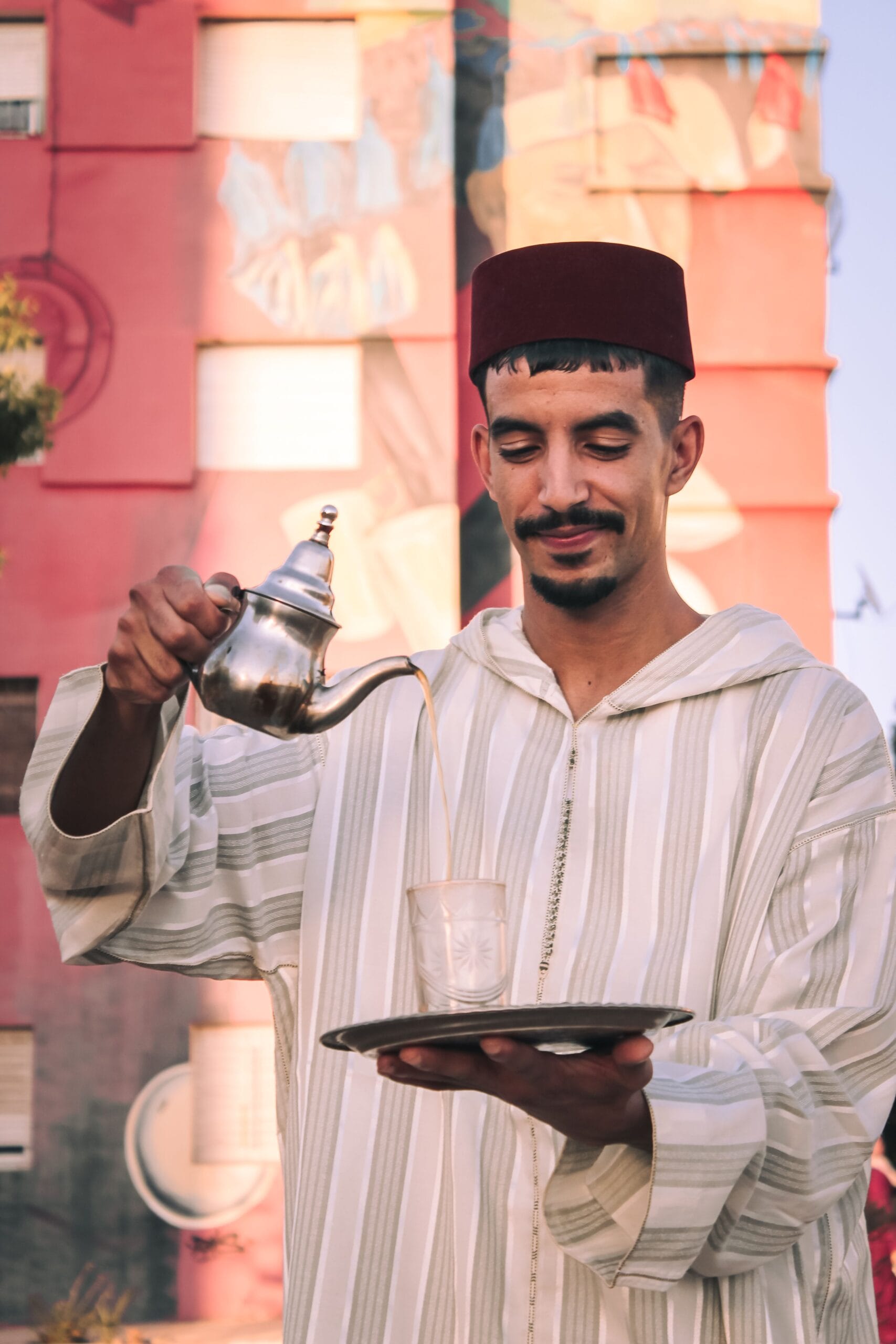 Moroccan mint tea poured from height to create foam